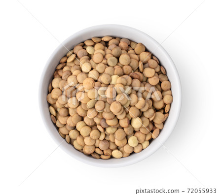 Uncooked lentils in white bowl isolated on white background 72055933