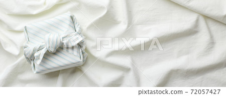 Eco-friendly gift wrap in traditional japanese furoshiki style, eco-friendly gift wrap and Zero Wast concept 72057427