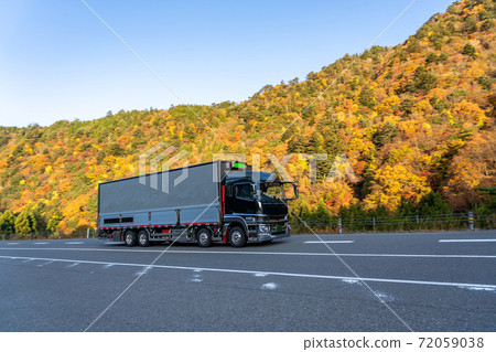 Happuu-kaido, Shiga Prefecture, a truck approaching the Ishigure Pass in autumn colors Happuu-kaido, Shiga Prefecture, a truck approaching the Ishigure Pass in autumn colors 72059038
