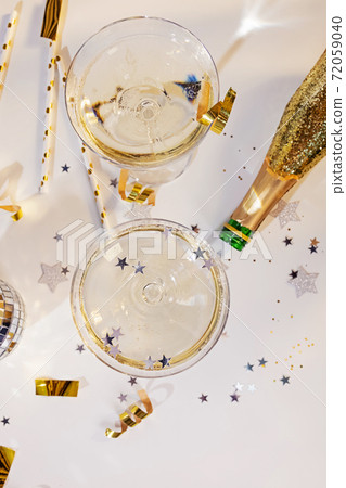 Two glasses of champagne in a coupe glasses Two glasses of champagne in a coupe glasses 72059040