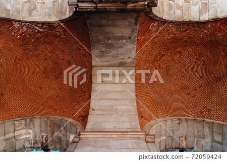 Red brick vault. Ceiling. Circular pattern.Architectural Texture 72059424