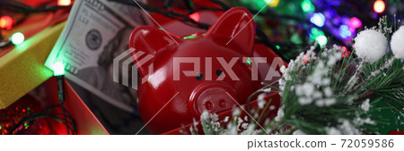 Christmas decoration gift box with red piggy bank and one hundred dollar bills. Christmas decoration gift box with red piggy bank and one hundred dollar bills. 72059586
