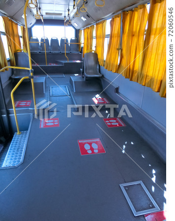 Interior of empty public bus. Seats are free. Coronavirus Pandemic lifestyle. Interior of empty public bus. Seats are free. Coronavirus Pandemic lifestyle. 72060546