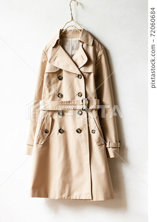 Light beige trench coat and white background 72060684