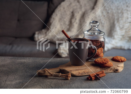 Cup of tea or coffee with cinnamon and cookies isolated on grey and white background. Copy Space for ad, design. 72060799