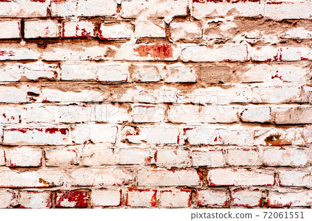 Texture of a brick wall with cracks and scratches which can be used as a background Texture of a brick wall with cracks and scratches which can be used as a background 72061551