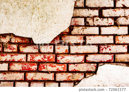 Texture of a brick wall with cracks and scratches which can be used as a background Texture of a brick wall with cracks and scratches which can be used as a background 72061577