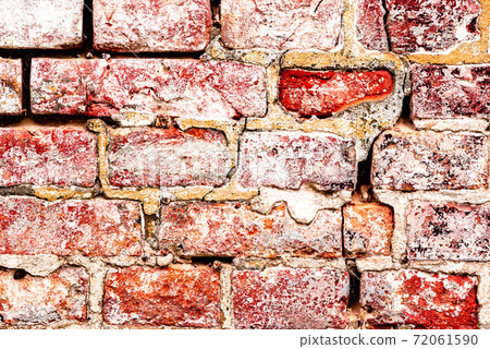 Texture of a brick wall with cracks and scratches which can be used as a background Texture of a brick wall with cracks and scratches which can be used as a background 72061590