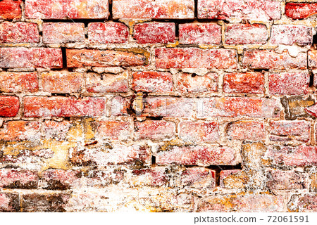 Texture of a brick wall with cracks and scratches which can be used as a background Texture of a brick wall with cracks and scratches which can be used as a background 72061591