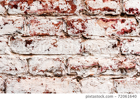 Texture of a brick wall with cracks and scratches which can be used as a background 72061640