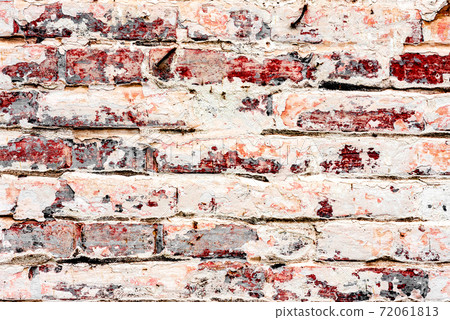 Texture of a brick wall with cracks and scratches which can be used as a background Texture of a brick wall with cracks and scratches which can be used as a background 72061813
