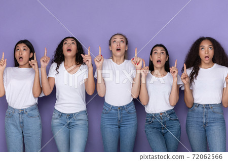 Five Amazed Ladies Pointing Fingers Up Standing Over Purple Background 72062566
