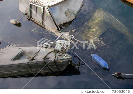 A small boat left submerged A small boat left submerged 72063046