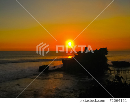 Tanah Lot and sea waves in golden sunset, Bali Tanah Lot and sea waves in golden sunset, Bali 72064131