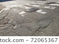 Cracked road 72065367
