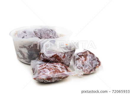 Homemade minced barf raw food for dogs packaged and frozen in serving size for preservation. Homemade minced barf raw food for dogs packaged and frozen in serving size for preservation. 72065933