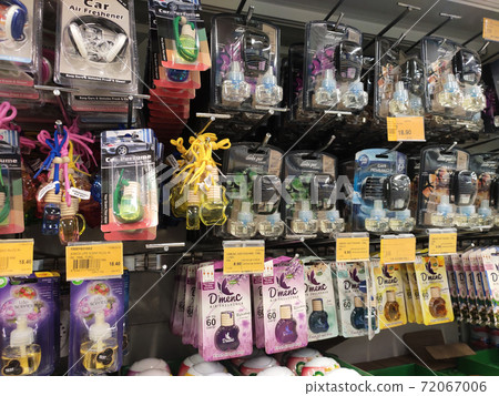 KUALA LUMPUR, MALAYSIA - OCTOBER 14, 2019: Various brand of car perfumes display for sale on the rack inside the supermarket. Sorted by the brand to make easy for the customer to choose. KUALA LUMPUR, MALAYSIA - OCTOBER 14, 2019: Various brand of car perfumes display for sale on the rack inside the supermarket. Sorted by the brand to make easy for the customer to choose. 72067006