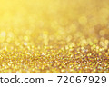 abstract blurred sparkling gold color glitter light background for website banner and card decoration    72067929
