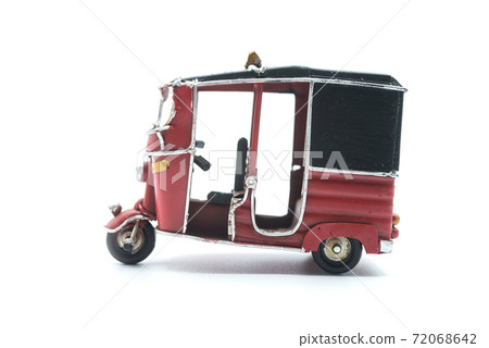 Closeup of miniature retro tuc tuc on white background 72068642