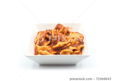 Closeup of industrial raviolis in a white plate on white background Closeup of industrial raviolis in a white plate on white background 72068645
