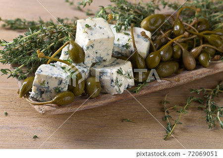 Blue cheese , capers and branches of thyme. Blue cheese , capers and branches of thyme. 72069051