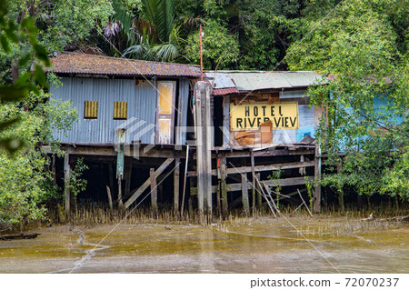 The unreal hotel on a river coast.  72070237