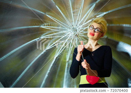 The clown with an umbrella. Health and fun concept. 72070400