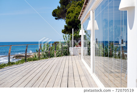 Fenced restaurant terraced area with sea view. Spain 72070519