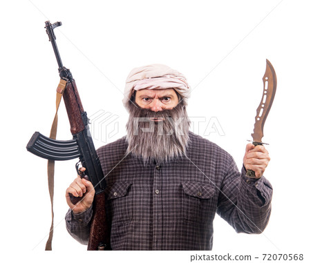 The bearded man armed with kalashnikov and knife isolated on a white background.  72070568