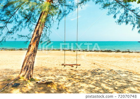 Swing on sand beach at tropical island 72070748