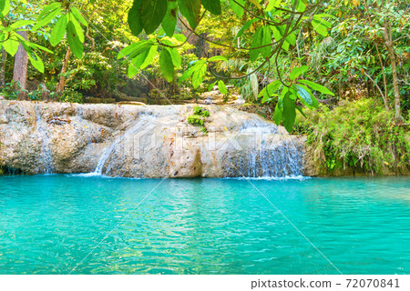 Tropical waterfall with emerald lake in jungle forest Tropical waterfall with emerald lake in jungle forest 72070841