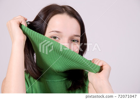 attractive girl hide face 72071047