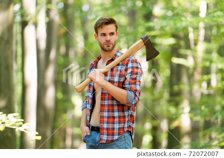 sexy male woodcutter hold axe in hands, forest life 72072007