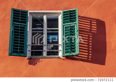 window with open shutter and flower in an old house in the countryside, shadow on the wall window with open shutter and flower in an old house in the countryside, shadow on the wall 72072111