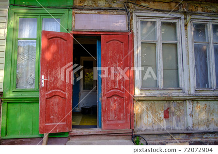 Old house with open door 72072904