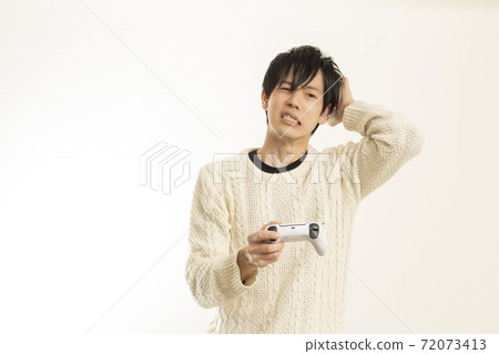 Men enjoying video games on the latest game consoles / game controllers / PS5 / Sony PlayStation 72073413