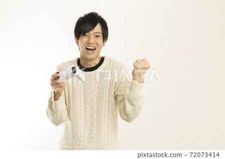 Men enjoying video games on the latest game consoles / game controllers / PS5 / Sony PlayStation 72073414