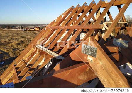 exposing the rafters to the background of the blue sky 72074246