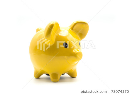 Closeup of yellow piggy bank on white background 72074370