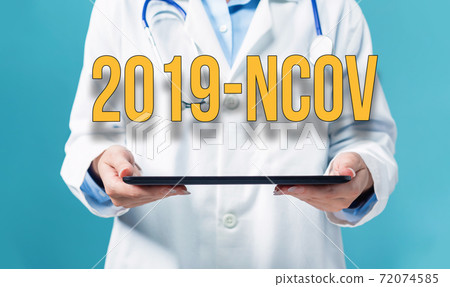 2019-NCOV theme with a doctor using a tablet pc 2019-NCOV theme with a doctor using a tablet pc 72074585