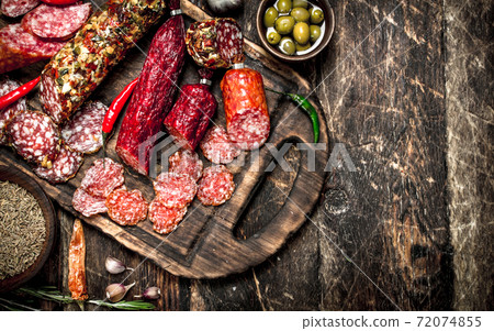 Different kinds of salami on the boards. 72074855