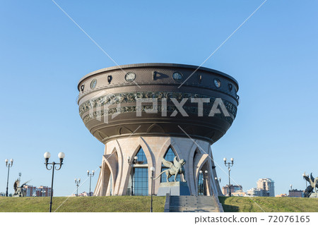 view of the building in the form of Kazan, photo was taken on a sunny summer day. view of the building in the form of Kazan, photo was taken on a sunny summer day. 72076165