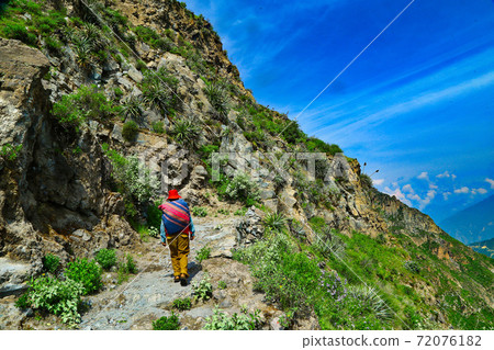Residents walking in the canyon Residents walking in the canyon 72076182