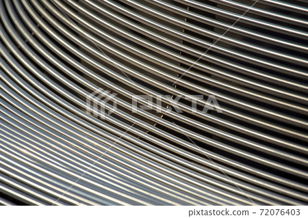 part of a metal outdoor bench. background abstraction part of a metal outdoor bench. background abstraction 72076403