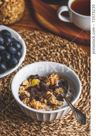 Bowl of Granola with Chocolate for Breakfast 72078230