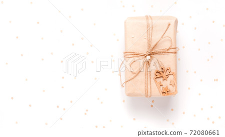 Gift box wrapped in craft paper with decor 72080661