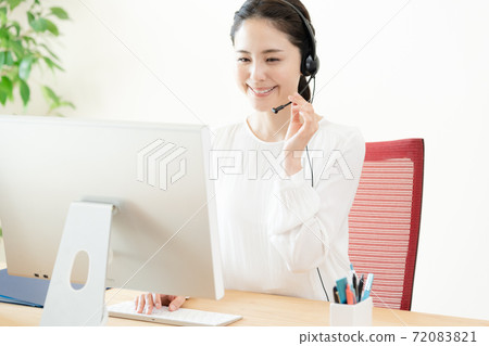 A young woman answering a phone call A young woman answering a phone call 72083821
