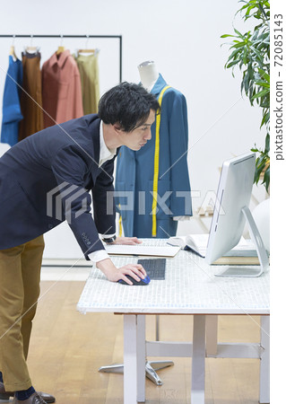 Fashion designer working in the office Fashion designer working in the office 72085143
