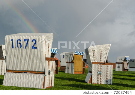 White wicker chairs with rainbow, Buesum, Schleswig-Holstein, Germany 72087494