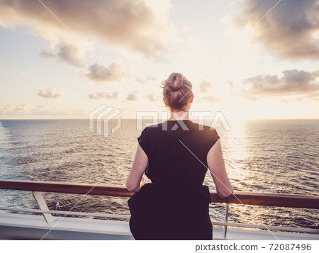 Fashionable woman on the empty deck of a cruise liner 72087496